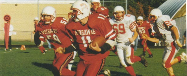 Faas carries the ball during a game against St. Agnes. As a senior, he was Minnehaha's quarterback and football captain.