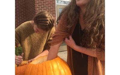 Debate team carves pumpkins