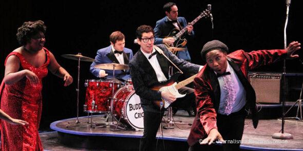 Buddy Holly (Nicholas Freeman) performs an energetic number during a showing of The Buddy Holly Story at History Theatre in Saint Paul. 