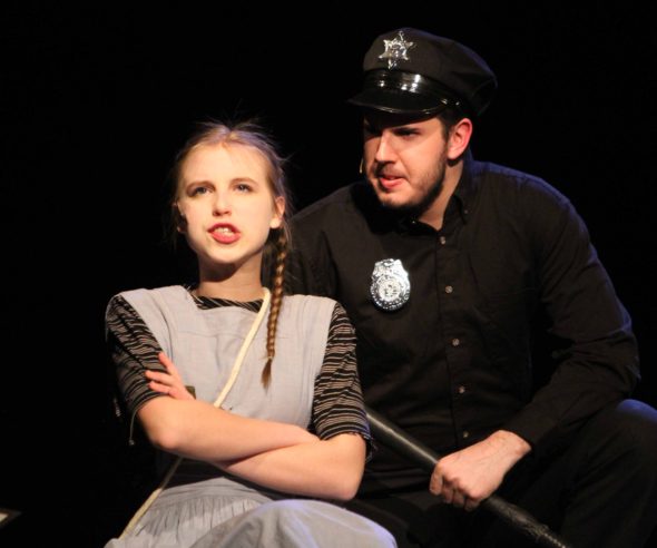 Little Sally (freshman Grace Anderson) and Officer Lockstock (senior Eli Aronson) talk about the rebellion and the meaning of Urinetown. 