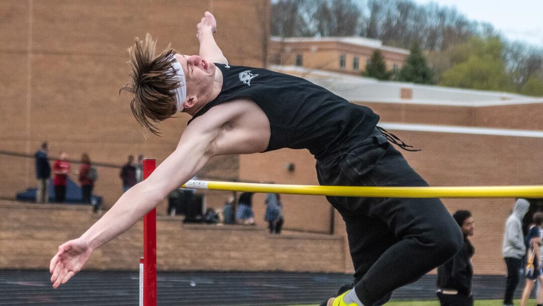Junior Ezra May attempts a high jump at the Gryphon Invitational. Photo by Ezra Victor.