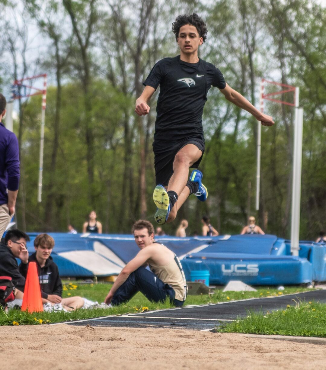 First-year Kellen Troup flies over the landing box in the 5.7.24 Blake Relay meet. Photo by Ezra Victor.