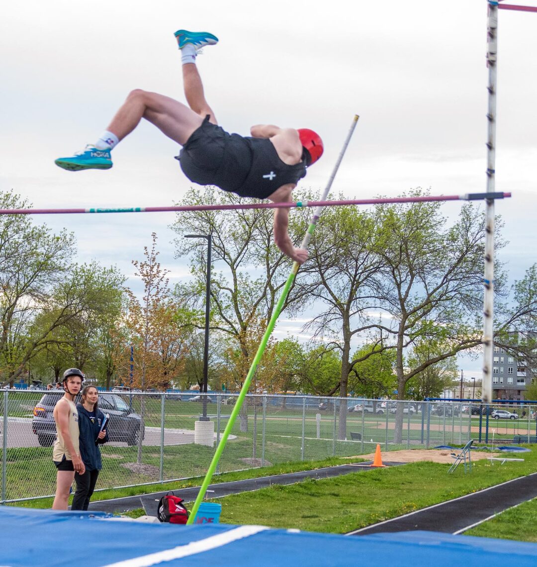 Junior Noah Hamburge competes at Blake. He led the team with a 10’ 0” pole vault. Photo by Ezra Victor.